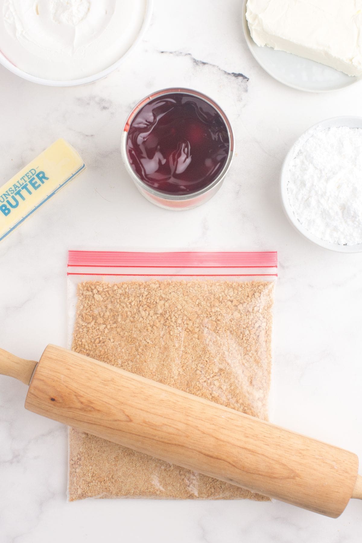 Graham crackers being crushed in a zip top bag.