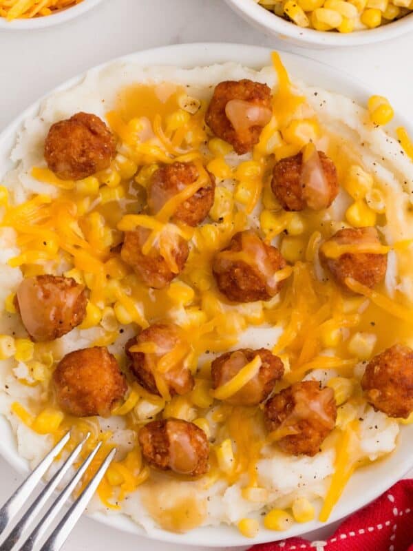 Over top view of the KFC bowl recipe with popcorn chicken and mashed potatoes in a bowl.