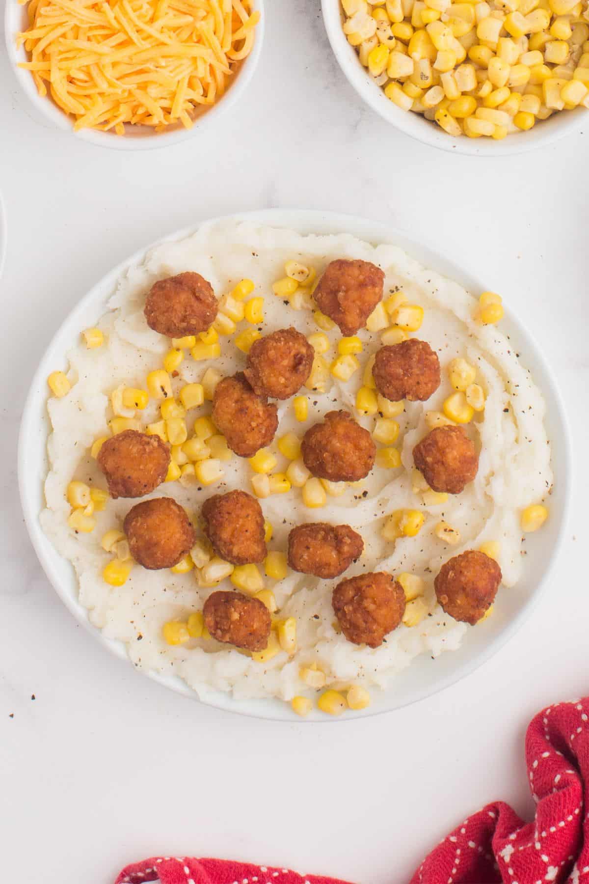 Popcorn chicken added on top of the KFC bowl.