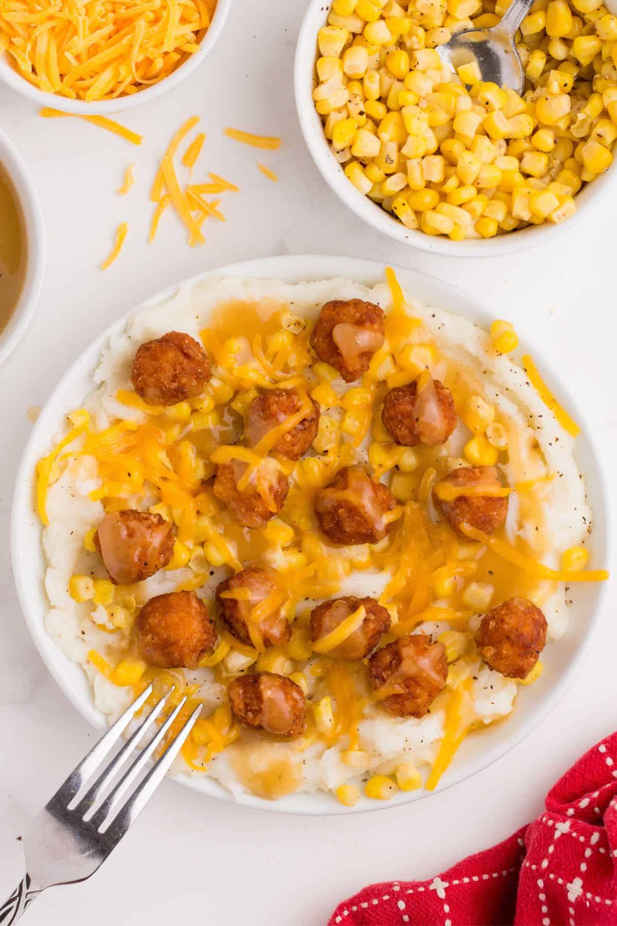 Finally, topped with cheddar cheese for a completed KFC bowl.