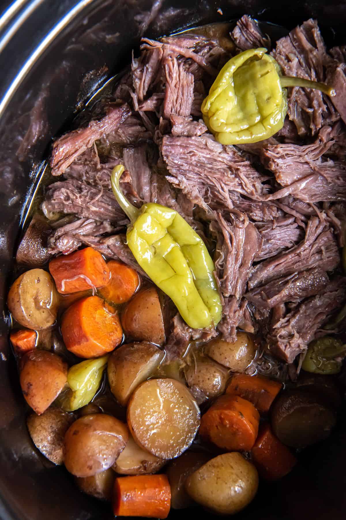 Mississippi pot roast Sunday dinner in a crock pot.